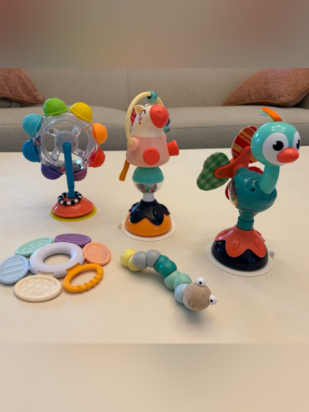 infant toy bundle including rattle and suction spinners